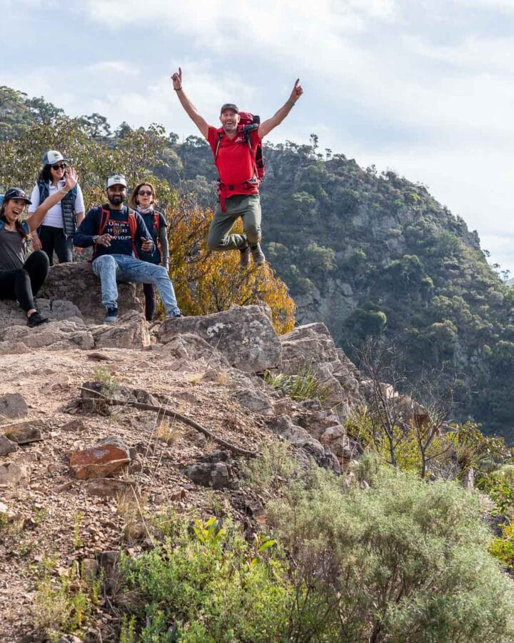 Group celebrating on a mountain peak
