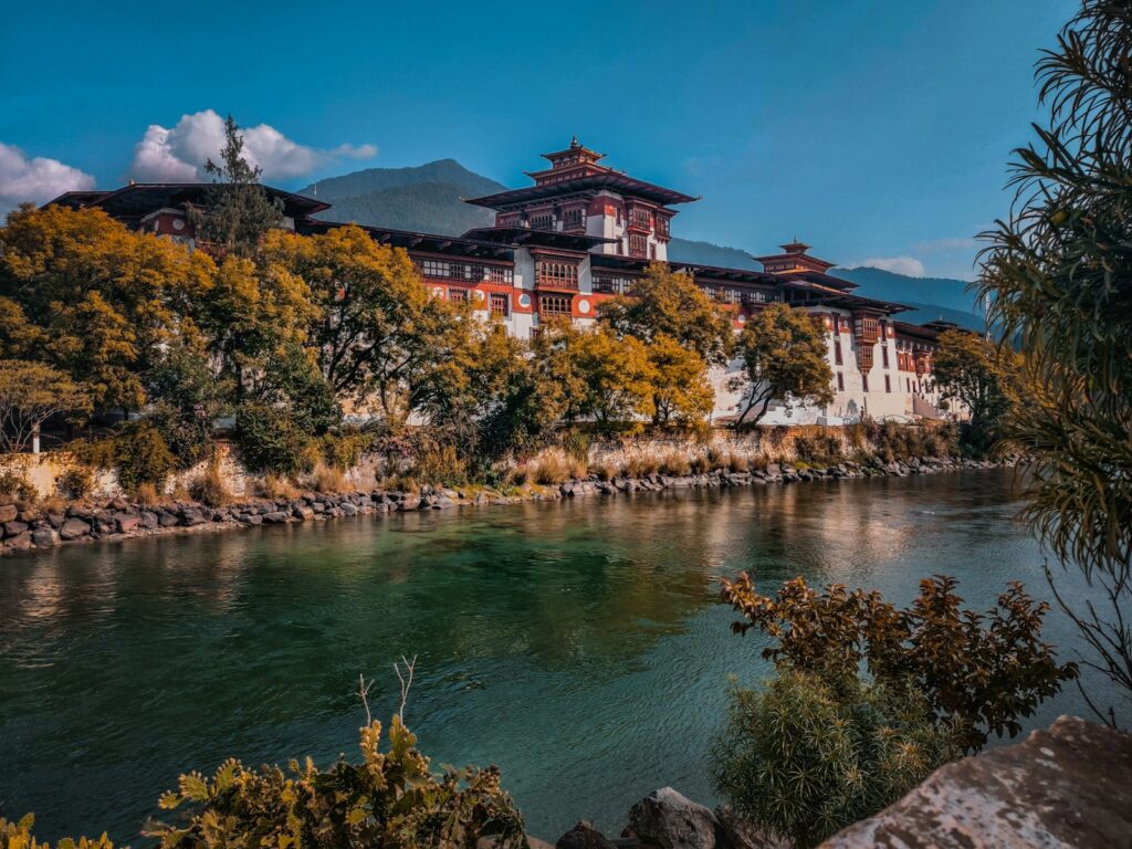 Punakha Dzong fortress monastery on hillside by the river, Bhutan