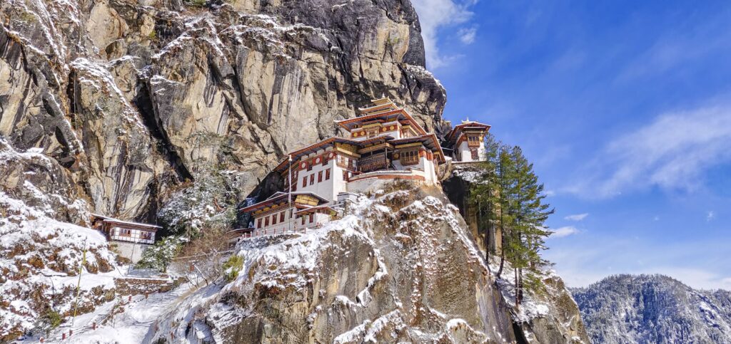 Tiger's Nest Monastery clinging to a snowy cliff face, Bhutan