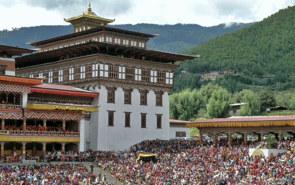 Tshechu festival gathering in Bhutan with traditional masked dances