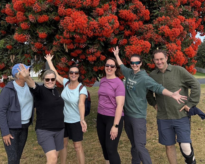Group of friends by flowering tree