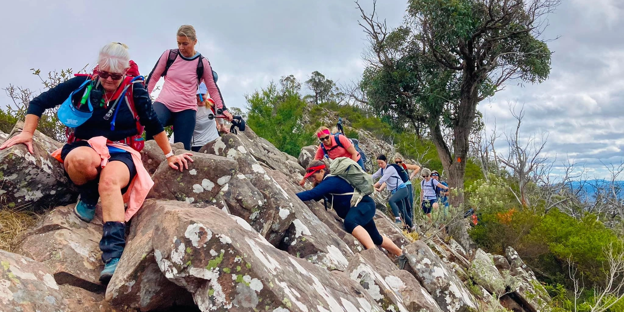 People with hiking gear walking through the Cathedral Ranges in Victoria